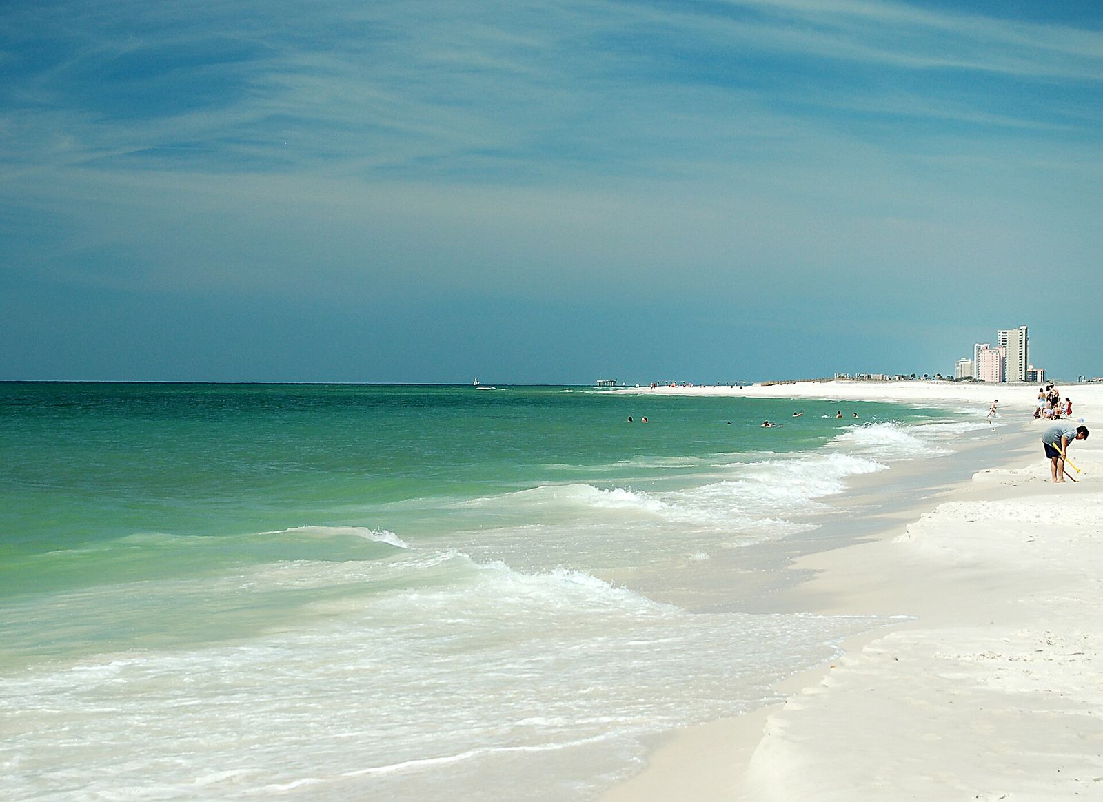 Waves rolling onto the white sand beach at Gulf State Park on the Alabama coast
