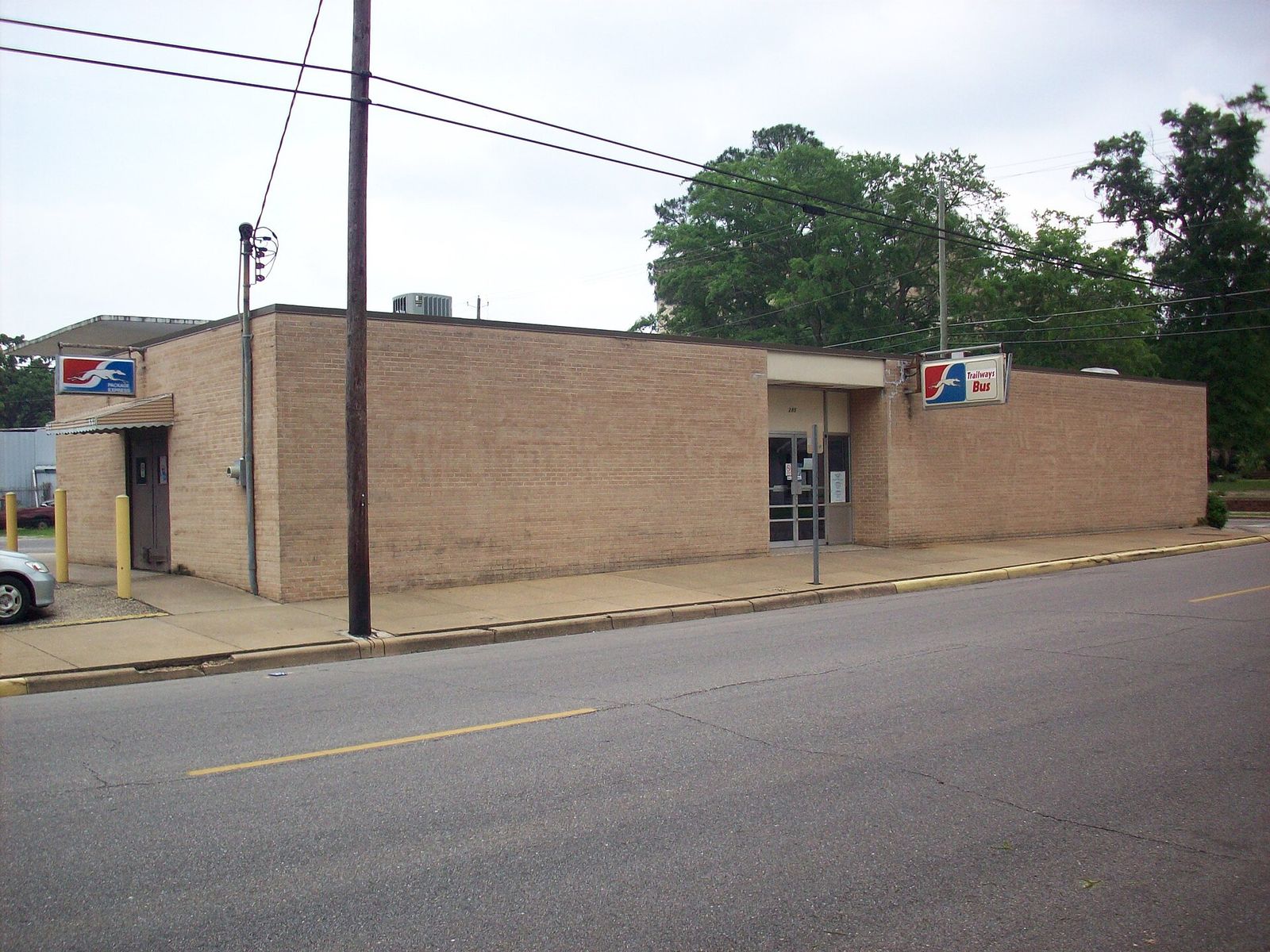 The Greyhound bus station in Dothan, a single-story brick building on a street corner