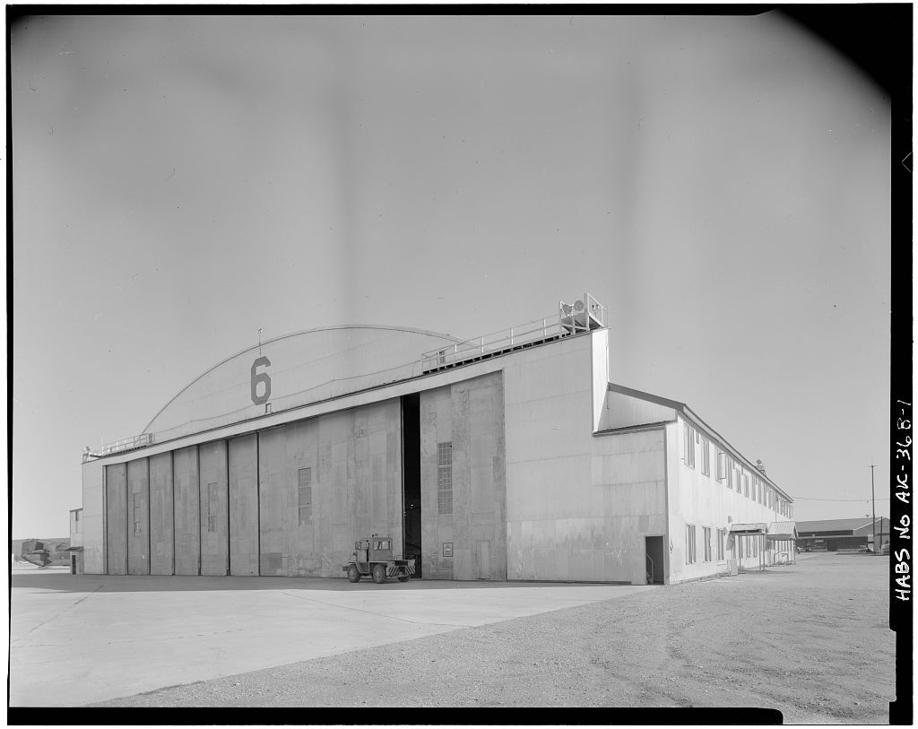 Black and white photo of a large arched hangar marked 6 at historic Ladd Field in Fairbanks