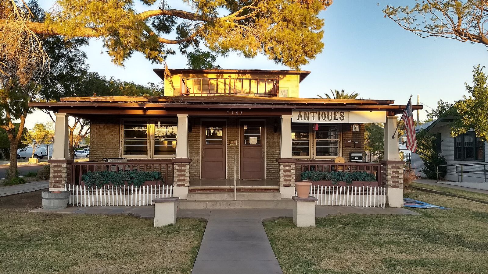 A Craftsman bungalow with a wide front porch, now an antique shop, in Glendale's Catlin Court Historic District