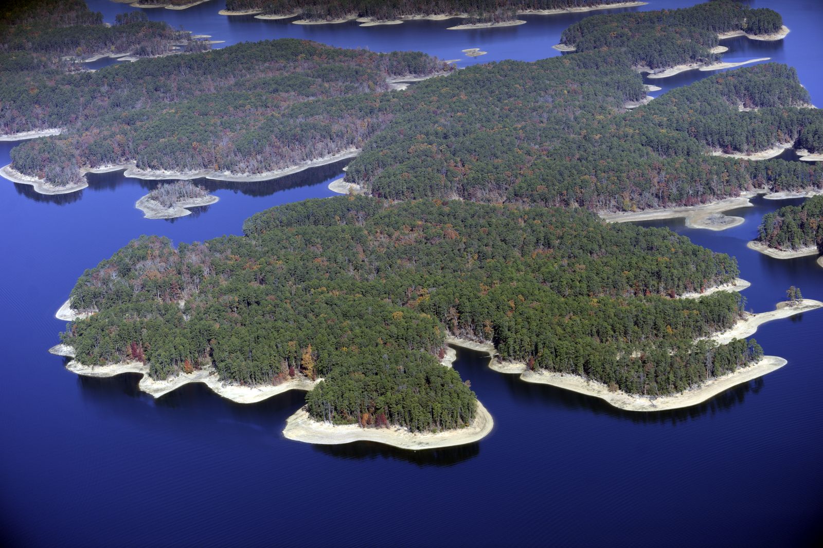 Aerial view of the wooded islands and blue water of Lake Ouachita, Arkansas