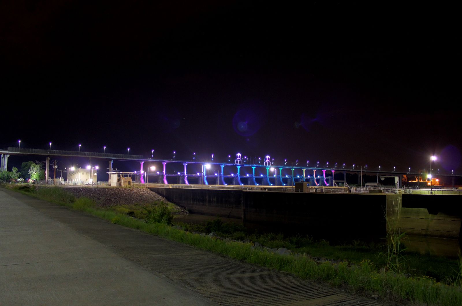 The Big Dam Bridge lit up at night over the Arkansas River in Little Rock