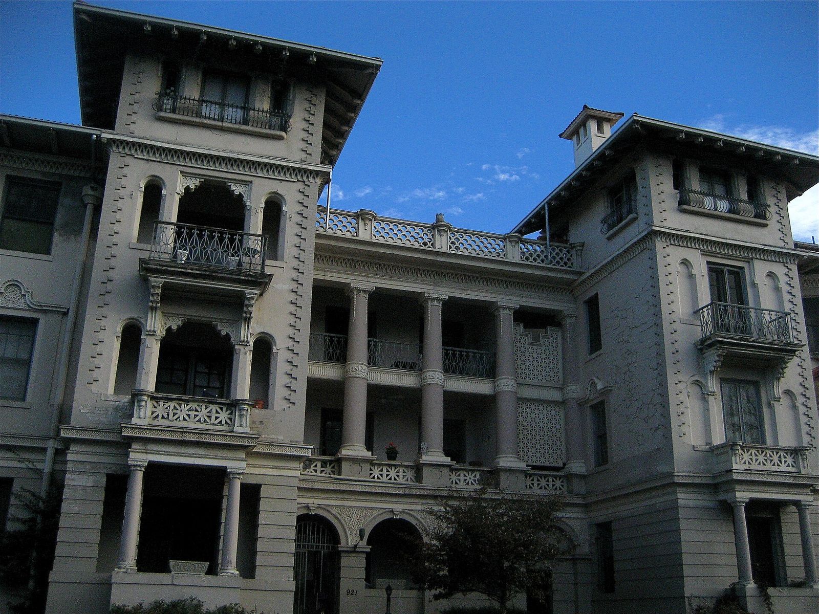 The historic Cornwall Apartments at 921 East 13th Avenue in Denver, with ornate balconies under a blue sky