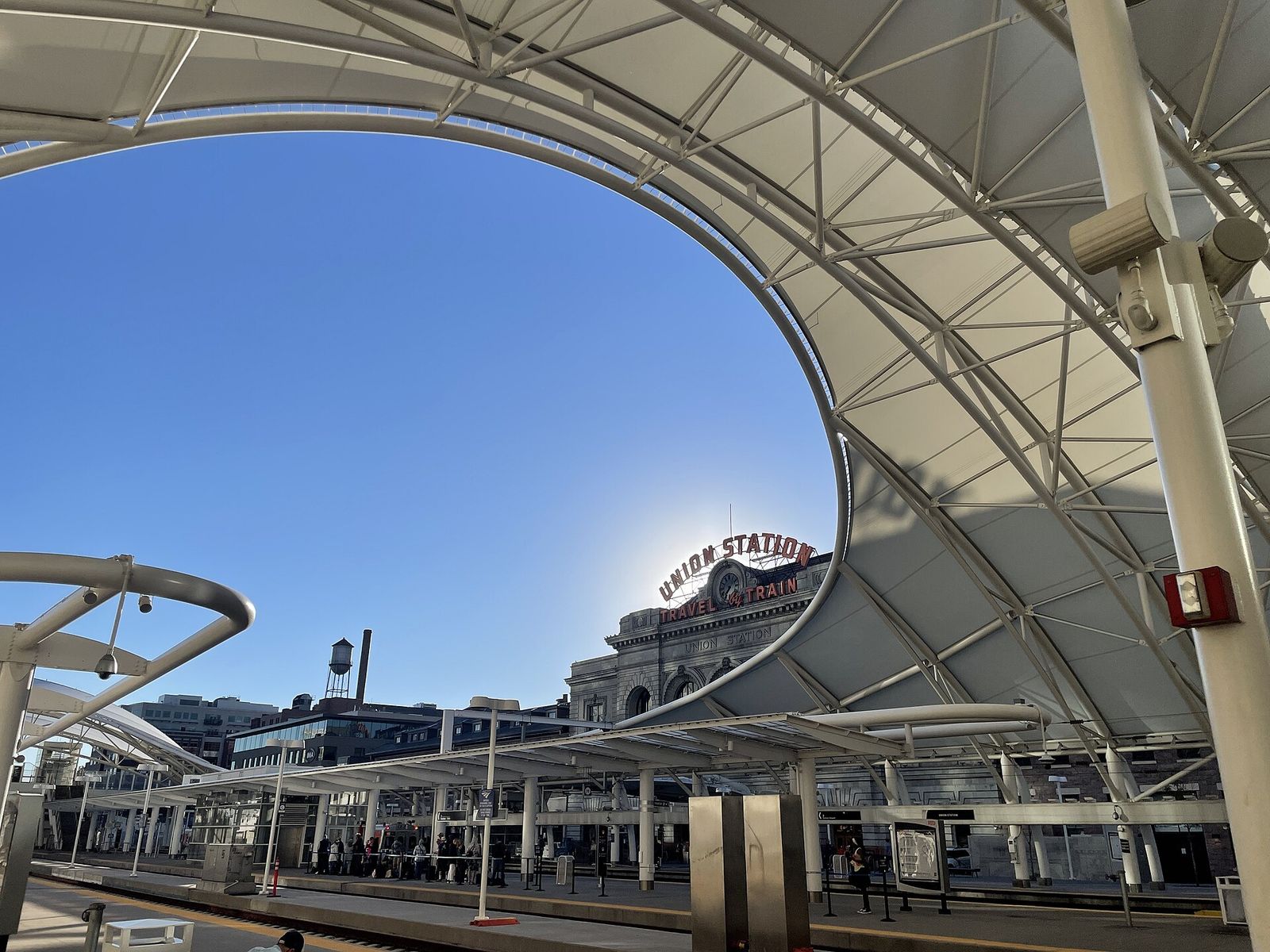 The front of Denver Union Station with its large arched windows and Union Station sign