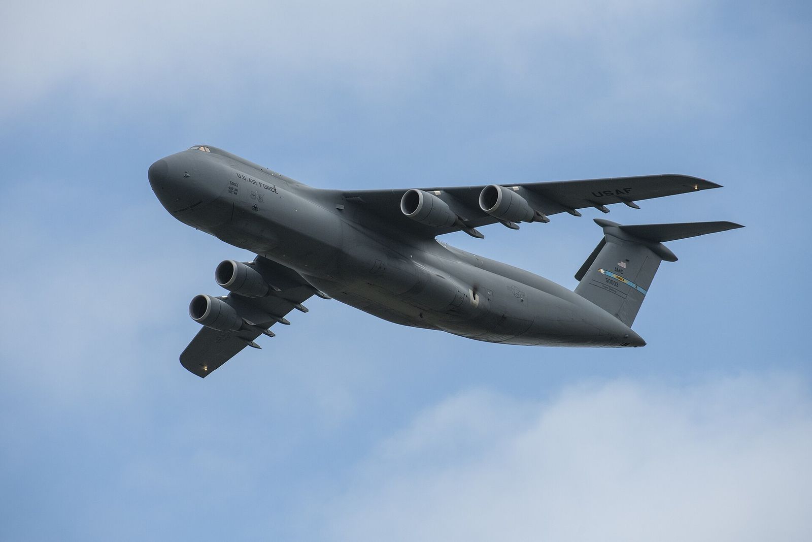 A C-5M Super Galaxy cargo plane flying low over Dover Air Force Base during the 2019 Thunder Over Dover air show