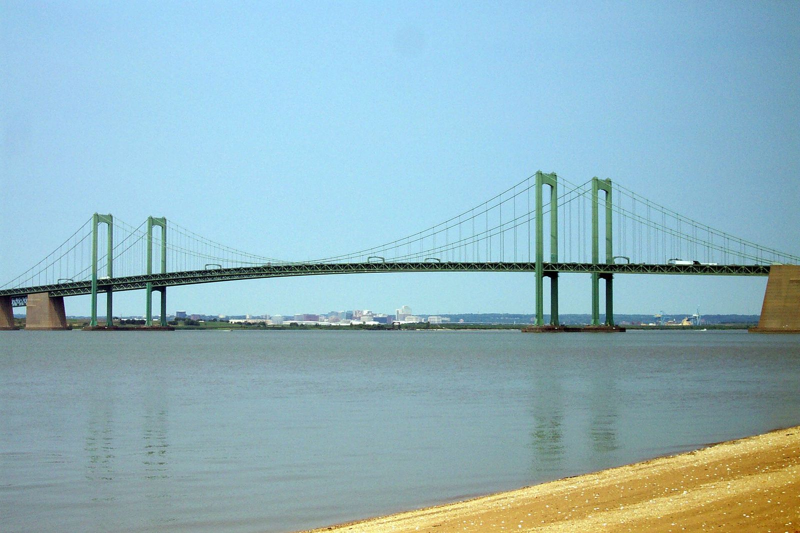 The twin suspension spans of the Delaware Memorial Bridge seen from the New Jersey side of the river
