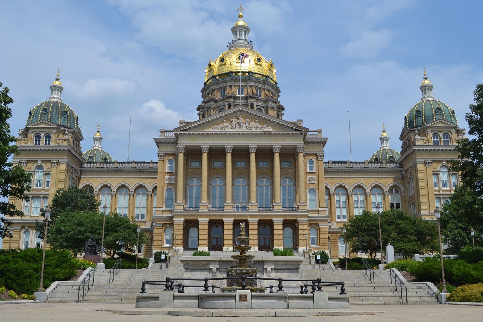 The Iowa State Capitol in Des Moines, with its gold central dome, four smaller domes and wide front steps