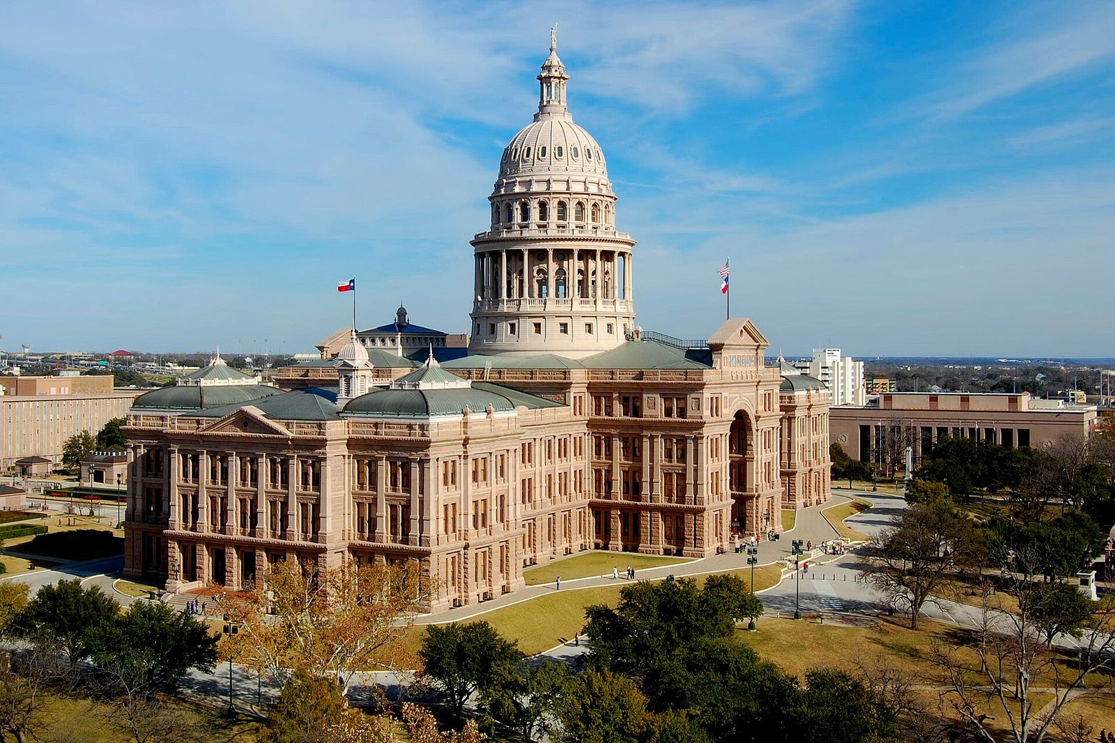The Texas State Capitol in Austin seen from above, with its dome, its grounds and downtown buildings around it