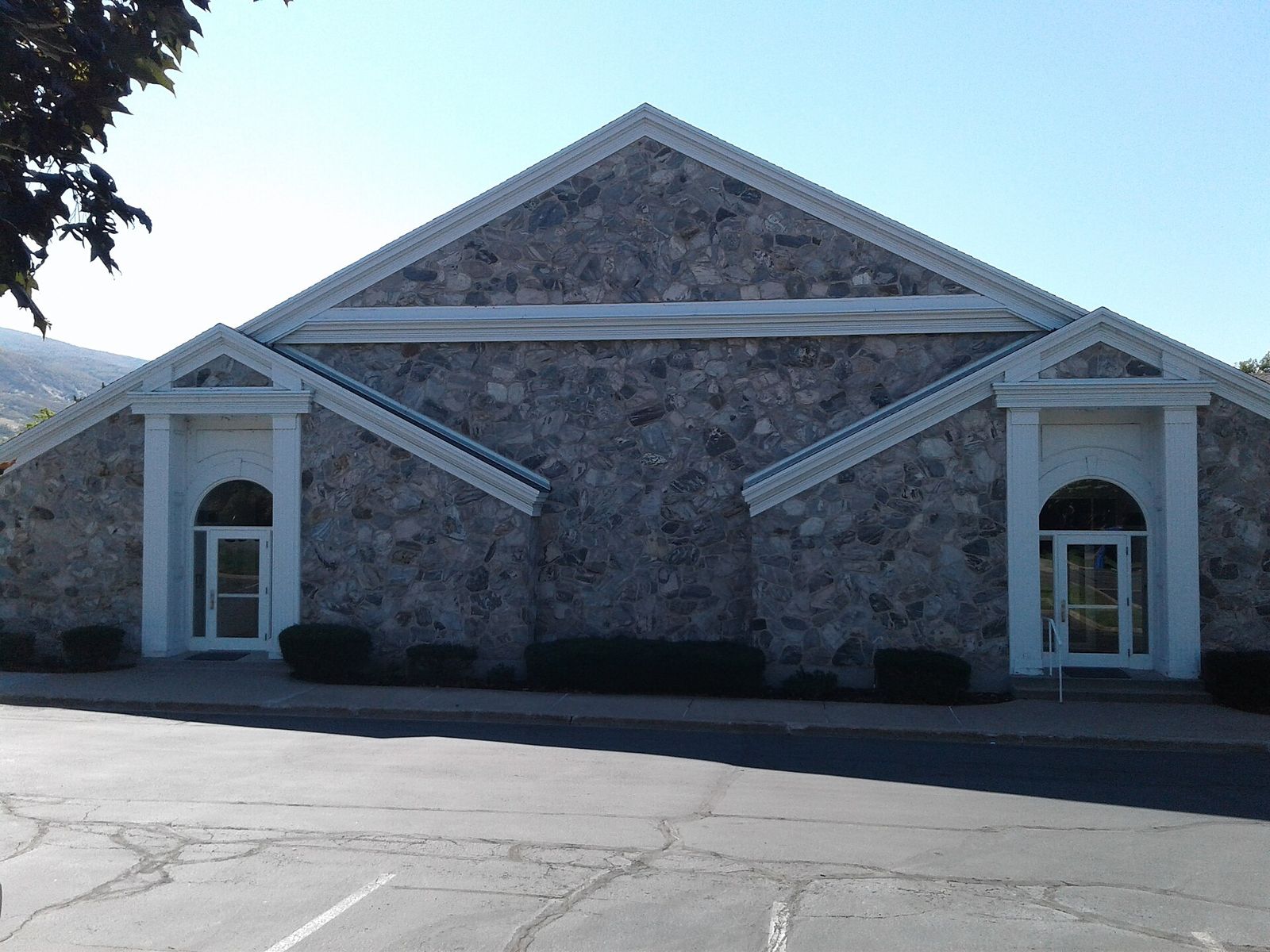 The Farmington Rock Chapel, a stone building with arched windows and a white-trimmed gable