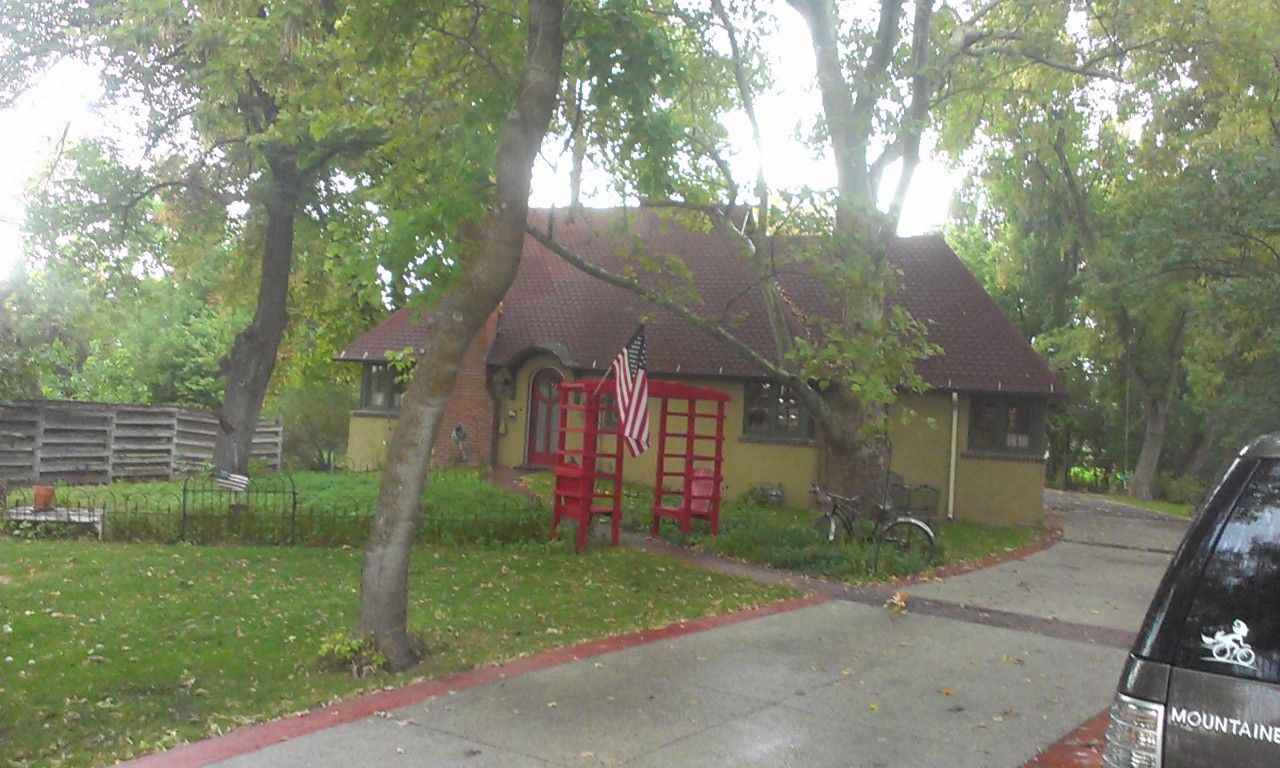 The LeConte Stewart House in Kaysville, a small home set among tall shade trees