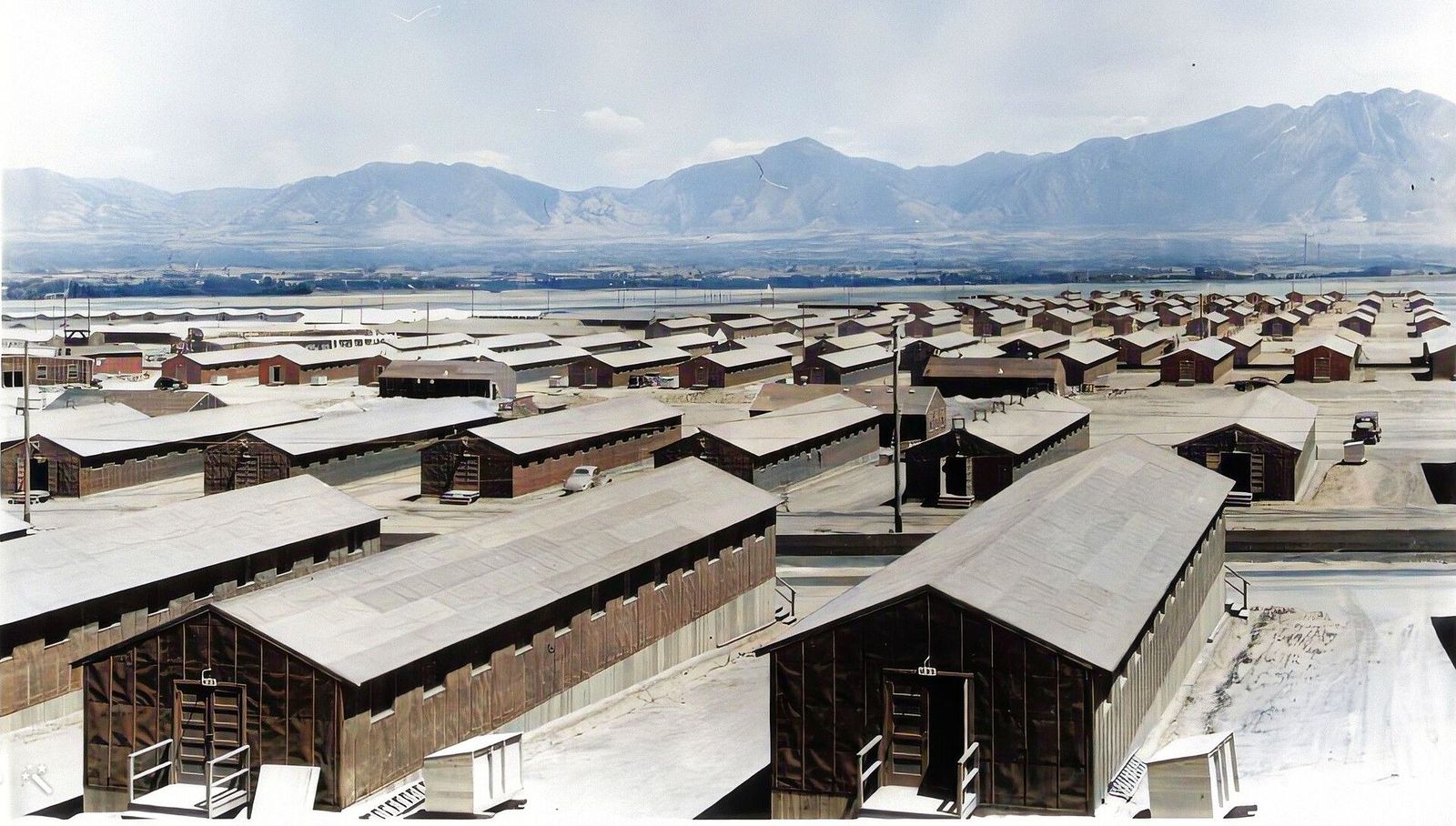 Rows of wooden barracks at Kearns Army Air Base in 1944, with the Wasatch Range in the distance