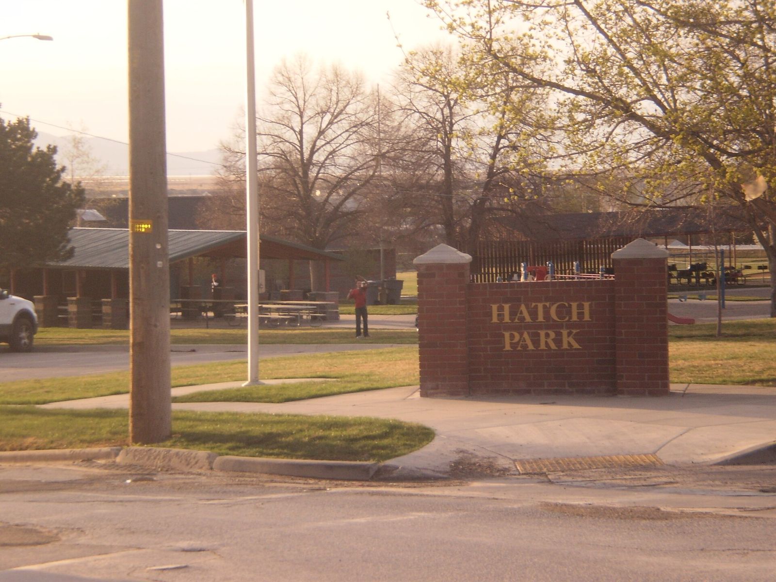The Hatch Park sign on Center Street in North Salt Lake, with trees behind it