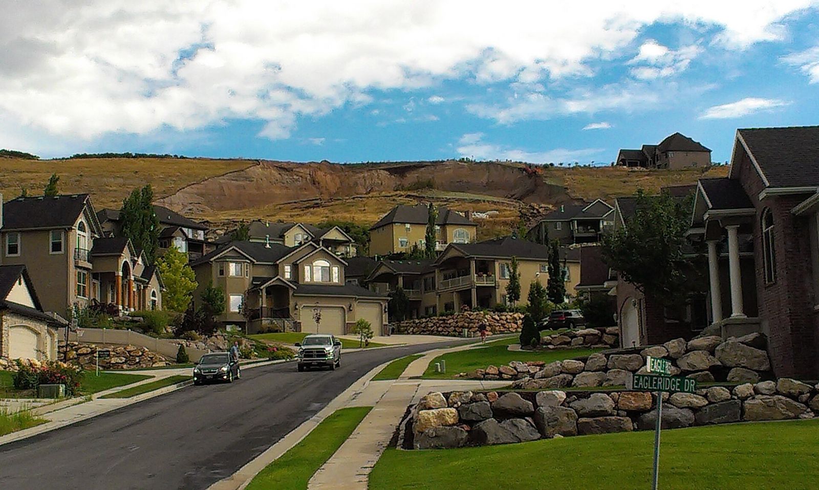 The bare cliff face left on a North Salt Lake hillside above houses after the August 2014 landslide